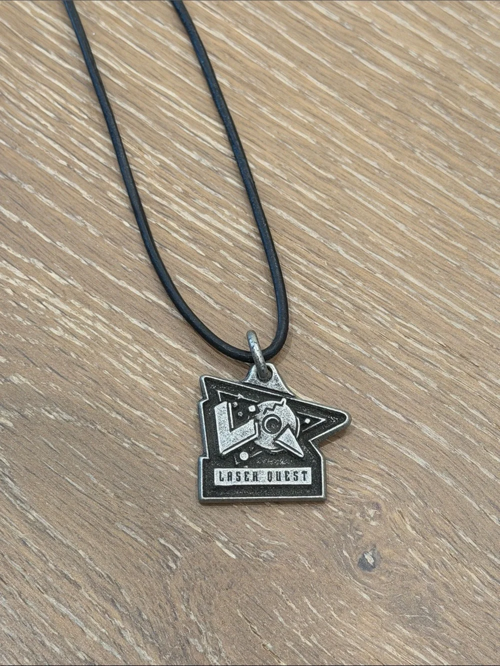 Vintage 1990s “Laser Quest” Black Cord Necklace with Metal Badge Pendant